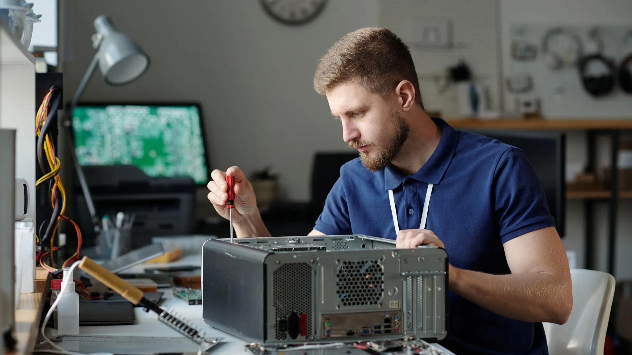 man repairing computers